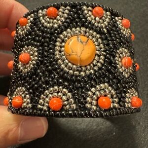 Orange and black seed beaded cuff bracelet. Size 7